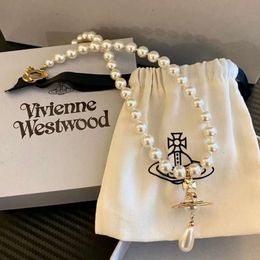 Designer Viviennes Westwoods Vivenne Westwoods Jewelry Western Empress Dowager Drop Drop Pearl chaîne Collier Saturne tridimensionnel