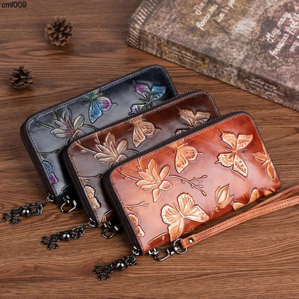 Cartera de diseñador Nueva capa superior de piel de vaca para mujer Presión del viento chino Color de la flor Toallita Moda larga {categoría}