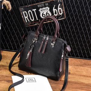 Ontwerper-vrouwen lederen tas luxe handtassen ontwerper handtassen klassieke patroon schoudertassen dames crossbody tassen met hanger met kwastje