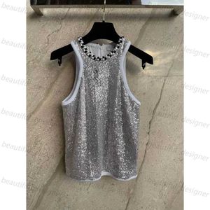 Designer Tshirt pour femmes Nouveau petit vent parfumé argent entier de travail lourd complet de travail à paillettes en tricot rond Pullover sans manches