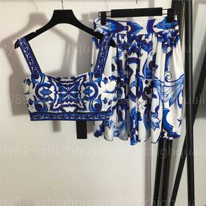 Conjunto de dos piezas de diseñador para mujer Conjuntos de falda sin mangas Ropa fresca de verano Estampado de celadón Camisola de moda Chaleco y vestido plisado azul de cintura alta Trajes de 2 piezas Ropa de mujer