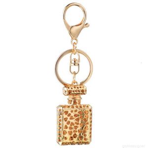 Designer Fashion Design Porte-clés Bouteille de parfum Porte-clés pour femmes Creative Cristal Strass Diamant Métal Voiture Porte-clés Chaîne Sac Pendentif Cadeau bonne catégorie