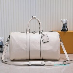 Diseñadores Moda Bolsas de lona Hombres Mujeres Bolsas de viaje Repujado Bolsos de cuero Gran capacidad Bolsa de viaje Equipaje Bolsa de fin de semana