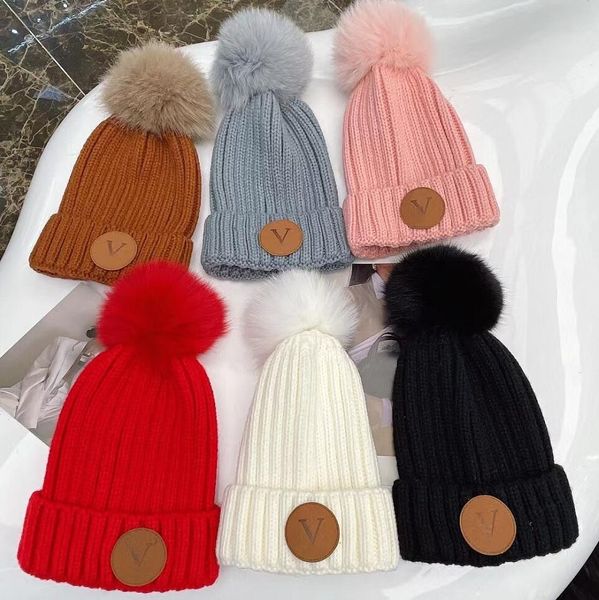 Diseñadores Gorro de punto de invierno Sombrero de lana Hombres Mujeres Punto grueso Grueso Cálido piel sintética pom Gorros Sombreros Gorro femenino Gorros Gorros de diseñador