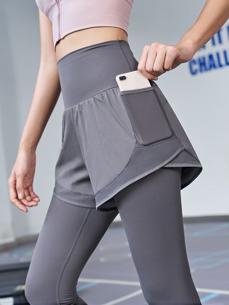 Diseños Pantalones de fitness para mujer de cintura alta falsos de dos piezas pantalones de yoga para correr medias elásticas ropa exterior de otoño pantalones deportivos de secado rápido