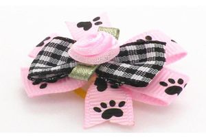 Vêtements de chien 100pclot arcs de cheveux de chat petits accessoires fleurs roses toilettage bandes de caoutchouc 1176784
