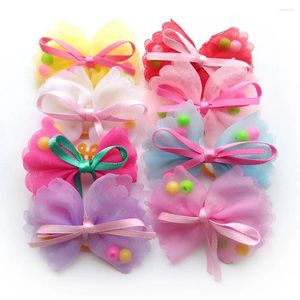 Appareils pour chiens 50pcs Bows de poils pour animaux de compagnie Polyester avec des élastiques de perles de toilettage accessoires produits