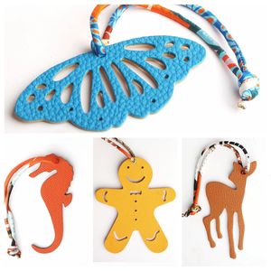 Dubbele gezichten 100% echt vol graanleer paardenpaard Seahorse herten hobbyhorse sleutelhanger rugzak hanger dieren vrouwen tas charm 240428