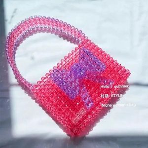 Drawstring mode textuur boog ontwerp acryl kristallen tas schattige roze splice kralen geweven dames tassen zomer veelzijdige dames handtas