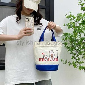 Trekkoord Koreaanse emmer tas canvas tas 2023 nieuwe handtas dames casual en schattig bento tas lunchbox tas om uit te gaanstijlvollehandtassenwinkel