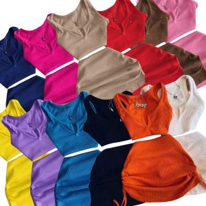 Jurken Designer Werkjurken Streetwear Knit 2 tweedelig jurksets Rokken Crop Tops Mini Rok bijpassende oranje trekkoord Zwarte pakken