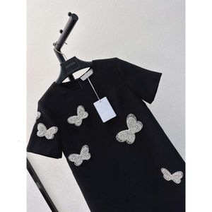 Jurken Dames Europees Modemerk Zwart Ronde Ronde Nek Korte mouwen vlinder kralen Decoratieve mini -jurk