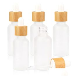 Bouteilles de compte-gouttes en gros 10 ml 20 ml 30 ml d'huile essentielle en verre givré et couvercles en bambou par échantillon flacons d'essence liquide cosmétique Drop del dhgo7