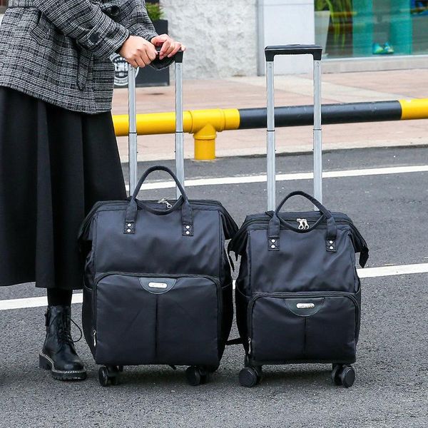 Bolsas de lona 2021 Bolsa con ruedas Travel Women Trolley Mochila con ruedas Oxford Gran capacidad Rolling Equipaje Maleta