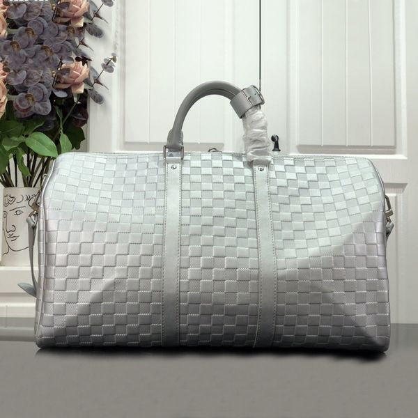 Sacs Duffel 50CM grande capacité vente de voyage femmes hommes sac à bandoulière en cuir véritable sac à main rivets de fond de bagage avec tête de serrure marque Y004 028