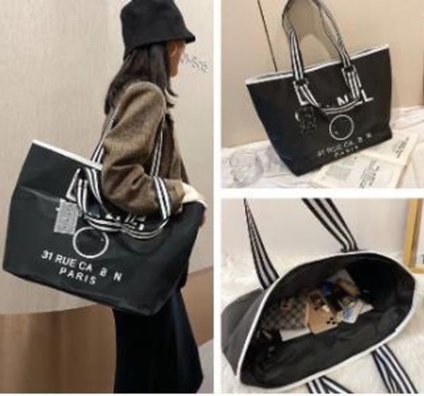 Bolsas de lona de lujo, bolsas de compras en blanco y negro, etiqueta triangular para mujer, bolsa de viaje de ocio impermeable, bolsa de nailon de gran capacidad para mamá