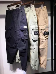 DUYOU Pantalons pour hommes Marque Designers Pantalon Métal Nylon Poche Brodée Badge Pantalon Occasionnel Mince Pantalon Réfléchissant Taille M-2xl 0074