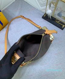 Vroege voorjaar cross -body tas reiskoffer draagbare portemonnees satchel ontwerper traditionele kofferelementen luxe handtas trunk tassen 9494
