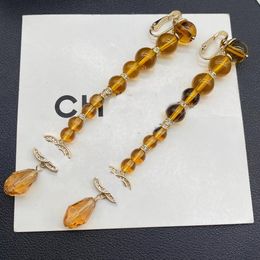 Boucles d'oreilles de styliste pour femmes, boucles d'oreilles à pampilles ambre, collier, ensembles de bijoux, boucles d'oreilles habillées françaises, Clips féminins avec boîte cadeau