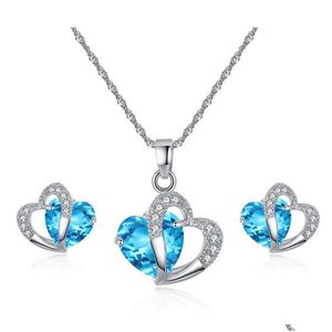 Collar de aretes Juego de joyas de cristal austriacos Cúconia cúbica Cz Sets de espárragos colgantes de doble corazón para mujeres Regalo de lujo Drop de Dh7it