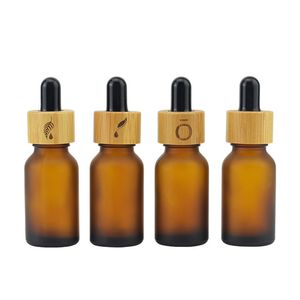 Couvercle compte-gouttes en bambou écologique Bouteille d'huile essentielle en verre ambré givré 5 ml 10 ml 15 ml 20 ml 30 ml 50 ml 100 ml Boston Round Glass Serum Cosmetic Bottle Wholesale