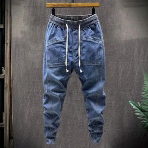 Elastische taille jeans heren elastische trekkoord taille denim vrachtbroek met zakken stevige kleur harembroek voor lente herfst 240424