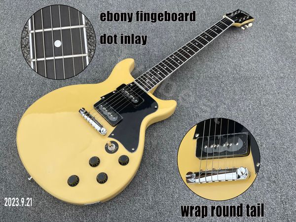Guitare électrique couleur crème solide, pièces chromées, pickguard noir, queue enveloppante, touche en ébène