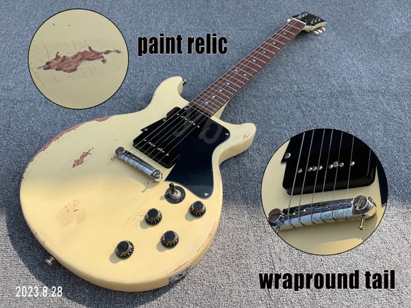 Guitare électrique JUNIOR couleur crème unie, peinture relique et pièces d'âge, queue enveloppante, micros p90, pickguard noir