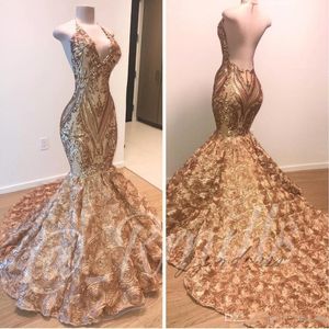 Elegant 2021 Afrikaanse goud prom jurken Mermaid Halter V Nek 3D Flowers Mouwloze avondjurk Lang Arabische Dubai Party -jurken