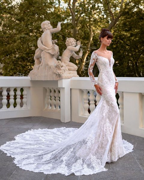 Appliques élégantes dentelle Illusion cou robe de mariée sirène manches longues superbe train trompette robes de mariée avec des imprimés floraux