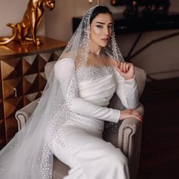 Vestidos de novia de sirena con perlas elegantes, vestido de novia de satén con cuello transparente, vestidos de novia de manga larga fruncidos árabes de Dubái para iglesia