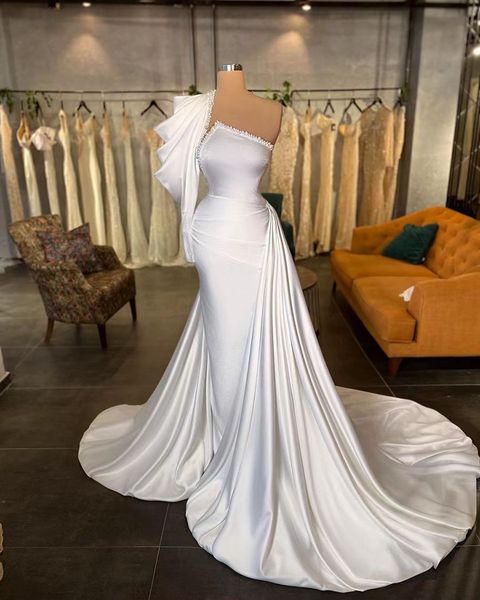 Muestra elegante Mancha Sirena Vestidos de novia Sin mangas Sin tirantes Con cuello en V Lentejuelas Apliques brillantes Perlas de encaje Forma Vestidos de novia Vestidos de novia por encargo