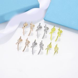 Élégant T or Bow boucles d'oreilles en argent femmes rose Stud couple sac de flanelle en acier inoxydable épais Piercing bijoux cadeaux femme accessoires en gros