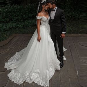 Robe de mariée élégante blanche à manches longues en dentelle florale robe de mariée sirène avec train détachable