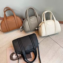 Bolso elegante para mujer, bolso de bolos, bolso pequeño para multitud, bolso de piel de vaca de primera capa, bolso Mantou, bolso cruzado portátil para personas mayores