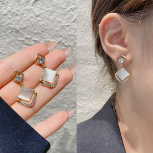 Élégants boucles d'oreilles en cristal zircon dangel pour femmes simulation en nage de perle