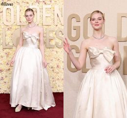 Elle Fanning 2024 Golden Globe Awards Tapis Rouge Robes De Célébrités Ivoire Satin Femmes Élégantes Robes De Soirée Formelles Gros Arc Bretelles Brillant Princesse Robe De Bal CL3186