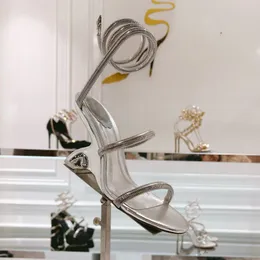 Sandalias brillantes de metal adornadas Strass de serpiente Tacones de 9,5 cm Tacones altos para mujer Diseñadores de lujo Zapatos de noche envolventes en el tobillo Fondos de boda dorados Calzado de fábrica