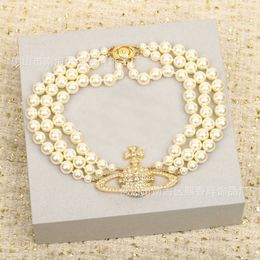 Emperatriz viuda Xi tres capas perlas llenas de diamantes Vivian Saturno plata oro dulce fresco planeta clavícula cadena nueva exageración