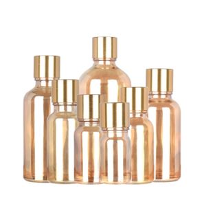 Lege Amber Gold Glass Bottle Ronde Schouder Glinend gouden schroefdeksel met plug draagbare cosmetische navulbare verpakkingscontainer 5 ml 10 ml 15 ml 20 ml 50 ml 100 ml 100 ml