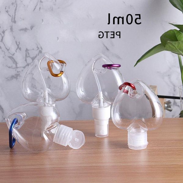 Bouteille rechargeable d'alcool en plastique vide coeur d'amour 50 ml bouteilles transparentes de désinfectant pour les mains en PET avec crochet porte-clés facile à transporter Qqpmb