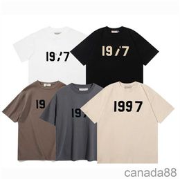 Ess Designer Tees Футболки Essent 1977 Essentialshirt Свободная повседневная футболка большого размера Топы из 100% хлопка для мужчин и женщин Футболка Essentialclothing OVF2 L3GV