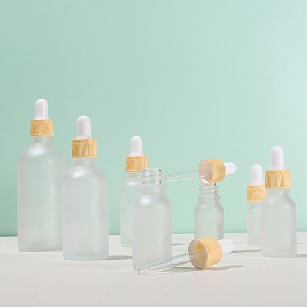 Bouteilles de parfum d'huile essentielle Flacon compte-gouttes en verre dépoli de 5 à 100 ml avec capuchon en bois en plastique