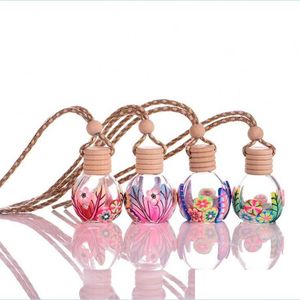 Diffuseurs d'huiles essentielles voiture suspendue par bouteilles Colorf Fleur Pendentif Aromathérapie Bouteille Diffuseur Désodorisant Ornement Drop Delive Dhofk