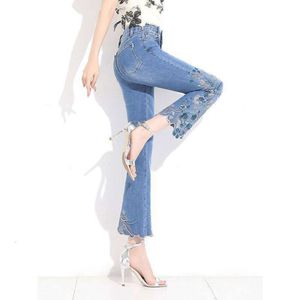 Etnische stijl geborduurde micro -wijd uitlopende jeans voor dames 2023 lente en herfst nieuwe hoge taille en hoge bijgesneden wijd uitlopende broek