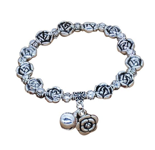 Corde élastique perlée à la main de style ethnique rétro Miao argent bracelet en argent tibétain cloche rose fleur poisson bracelet WY1584
