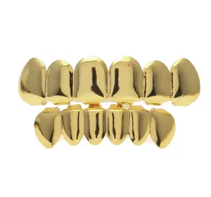 Europa y América Real chapado en oro dientes grillz esmalte oro grillz dientes hip hop bling joyería hombres cuerpo piercing joyería