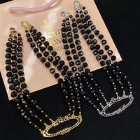 Collier pendentif européen et américain trois couches de noire perle d'agate à centaine de clavicules vintage femelle