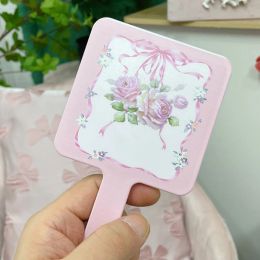 Miroir manuel portable simple européen fille rose rose rose mignon petit maquillage miroir de décoration intérieure de maquillage de maquillage miroir