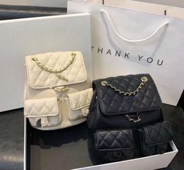 Bolsos de noche Mochila de moda Fábrica % 85% Venta al por mayor y al por menor Nueva Xiaoxiangfeng Duma Rana Caviar Diamondback Cadena Doble bolsillo Litchi Patrón Mochila